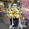 Arrangement of fresh yellow and white flowers with some greenery in between