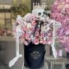 Beautiful pastel arrangement in our signature black velvet box with the skeleton