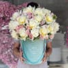 Pink peonies with deep purple roses and pittosporum leaves!
Peony colors may vary