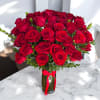 A stunning mix of 25 premium red roses and greenery in a