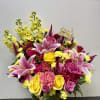 A joyful burst of color, this birthday arrangement shines with golden yellow