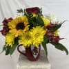 Fresh Red, Yellow and White Mix of fresh Flowers in a ceramic