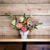  Simple yet elegant footed vase with seasonal flowers. colors and flowers