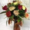 A fresh mixture of Fall colored Roses, Mums, Dahlia&#039;s, Carnations, and greens