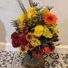 Ceramic Pitcher with Designer Choice Flowers. The flowers pictured are not a