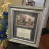 Our framed decor pieces can have a white or brown wood frame.