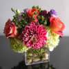 Dahlias, Roses, Hypericum, and Lisianthus arranged into a modern cube arrangements with