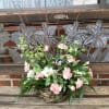 Birds nest filled with seasonal flowers 