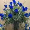6 beautiful blue Roses arranged in a vase with greens, fillers and