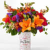 This bright and cheerful combo of roses, lilies, stock and more is