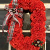 Made with silk carnations, buckeyes and a bow. 20 in tall x