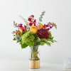 A bouquet made up of fall tones in this gold dipped cylinder