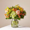 This radiant bouquet is designed with a dreamy mix of peach, yellow