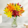 The rich colors of autumn come alive in our lily bouquet. Red