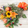 Let our designers choose a variety of seasonal jewel tone blossoms to