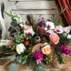 A subtle color scheme with seasonal fresh flowers, foliage and dried elements