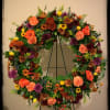 An exquisite array of fall colors make up this beautiful wreath, and