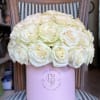 A luxurious hatbox filled with premium white roses, symbolizing purity and elegance.