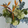Tropical-inspired arrangement brings together the exotic beauty of Birds of Paradise with