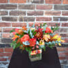 Brilliant fall hues fill this bouquet! Bright orange roses, fall mums, orange