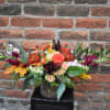 This bouquet has all of the colors and textures of fall! Vibrant