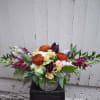 Luxurious greenery gracefully arcs and pulls the eye towards a mix of