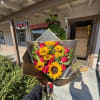 wrapped sunflowers with roses.