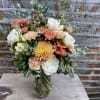 White Roses, Coral Mums, Dusty Peach Carnations and Soft Yellow Stock and
