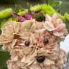 Here are two delightful carnation puppy bouquets available for sale:

Puppy Bouquet in