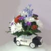 This is a police car replica used as a planter.  The