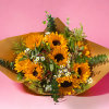 A bouquet of 8 long stem sunflowers and other flowers for any