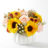 This dazzling bouquet in a ceramic pumpkin container will brighten up any