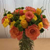 This vibrant and cheerful floral arrangement is perfect for brightening up any