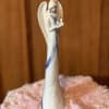 This beautiful Angel statue trimmed with blue, holding a dove is 10&quot;