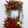 This stunning frame is made with red roses and other gorgeous red