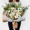 Designed in house with love, this One sided bouquet featuring seasonal blooms