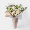 Designed in house with love, this One sided bouquet featuring seasonal blooms