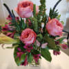 Lush and elegant, this designer arrangement blends soft pink garden roses, fragrant