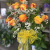 fresh dozen of roses in vase 
