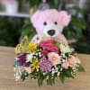 medium size pink plush with basket of fresh flowers 