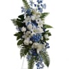 A sophisticated standing spray featuring a harmonious blend of white and blue