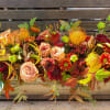 
This low centerpiece design is arranged in a 20&quot;x4&quot; wooden box. This