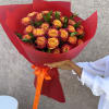 Ignite the senses with Firelight Kiss, a striking bouquet of fiery bi-color