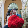 This breathtaking creation features a heart-shaped arrangement of over 250 velvety red
