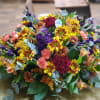 Centerpiece for the table with daisies, stock, carnations, mini carnations and alstroemeria