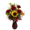 This rich red glass vase  is home to Sunflower, red Roses