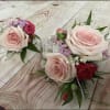 pink roses with hot pink accents as shown
white ribbon 
boutonniere to match
(