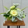 Very simple green and white arrangement consisting of veggie roses and Queen
