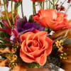 This elegant floral arrangement captures a dynamic balance of form and color