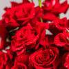This stunning floral arrangement showcases an artful blend of graceful forms and